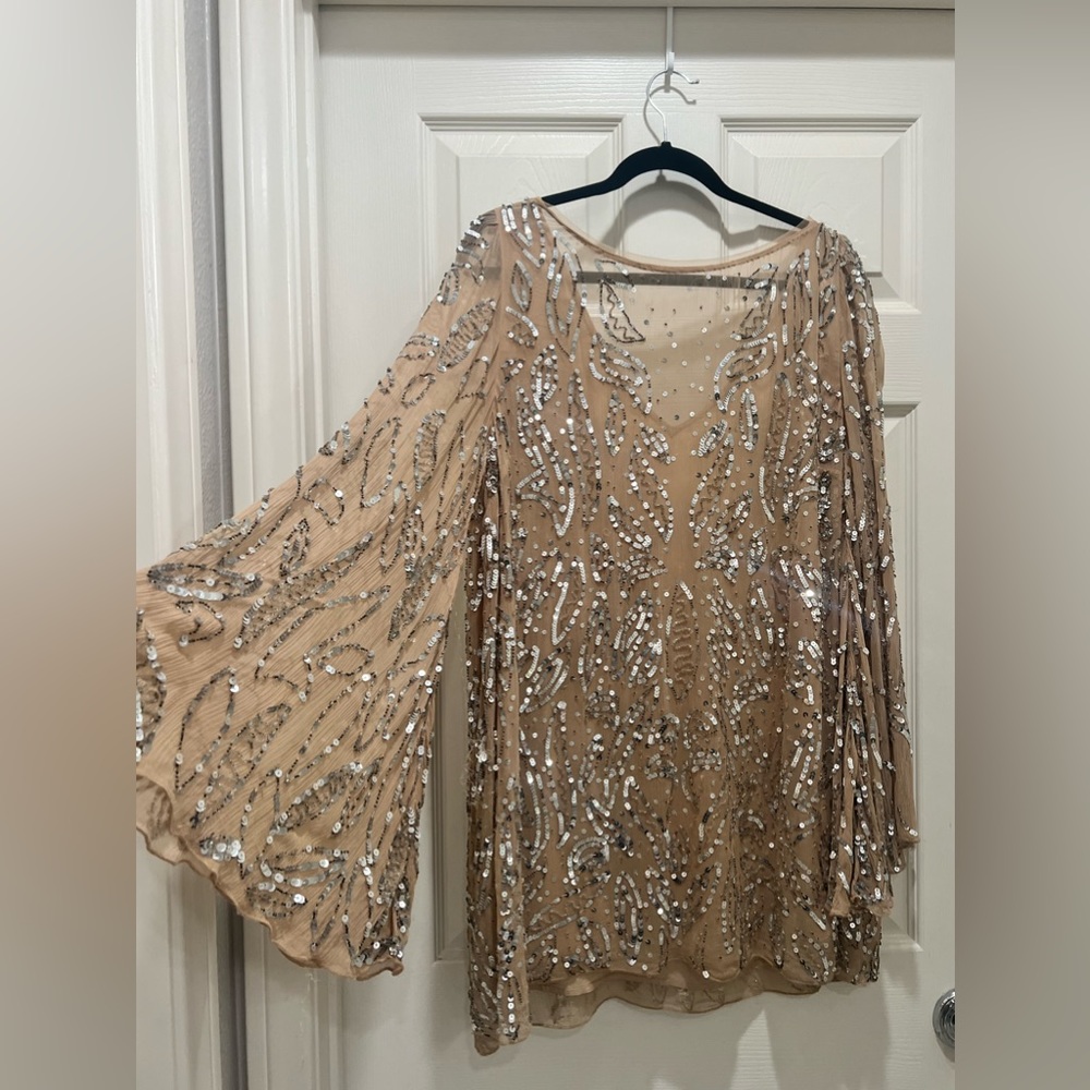 Free People sequin mini dress with long bell sleeves with satin tie back.